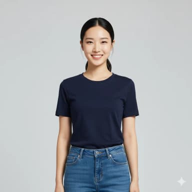 A close-up smart/sophisticated casual photo of a female cabin crew candidate, framed from head to waist. She is standing straight, directly facing the camera with a natural, happy closed-mouth smile. Her hair is tidy and behind her ears. Visible, professional makeup. She wears plain, fitted jeans (not white) and a plain fitted t-shirt (not white). Hands are by her sides. Simple, plain white background, with good, even lighting. No accessories or alterations.