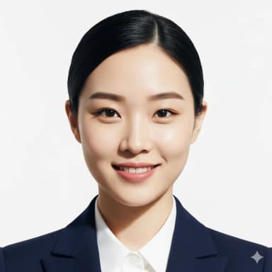 A professional studio-quality passport-sized photo of a female cabin crew candidate, framed from the collarbone to the top of the head. She is looking directly at the camera with a natural, happy closed-mouth smile. Her hair is pulled back neatly into a bun, behind her ears. Visible, professional makeup. She is wearing a white shirt or blouse under a closed fitted jacket. The background is plain white, with excellent, even lighting and no shadows. No accessories, glasses, or alterations.