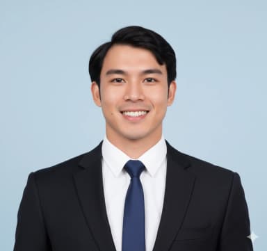 Studio-quality close-up portrait of a male cabin crew candidate, from the collarbone to the top of his head. He presents a genuine, natural open-mouth smile. His hair is perfectly groomed and tidy. He is clean-shaven. He wears a professional fitted suit jacket with a shirt and tie. The photo has a plain light blue background, is sharp, in focus, and naturally lit without glare.